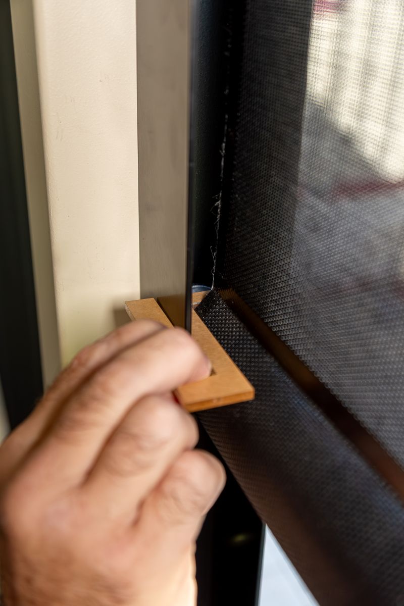 Wooden L-square measure tool used during channel install